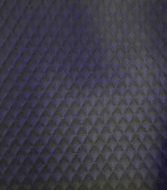Dark charcoal gray quilted diamond-pattern leather interior lining option for the Executive XLS-35 hyperbaric chamber